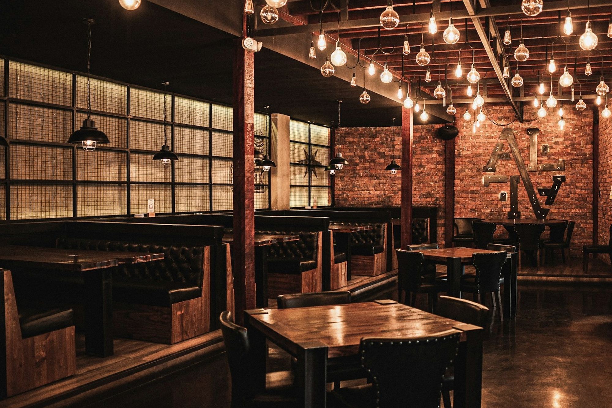 An empty restaurant room after service, lights still on